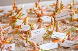 Starfish Escort Cards - Have fun with your escort cards - starfish with ribbons in a sand box for the guests!