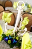 Nautical Centerpiece - For a nautical Theme use anchors and have fun with it. Rachel and Jonathan added flowers in their wedding colors to spice them up!